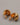 A close-up of a pair of high-gloss, real gold-plated hollow dome earrings featuring 925 sterling silver posts and clear silicone earring backs, resting on a smooth grey background.-4
