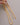 A close-up of a long, thick gold snake chain necklace showing its smooth, fluid flat herringbone texture, featuring a lobster clasp and a 5cm extension chain, resting on a clean grey background.-1
