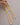 A close-up of a long, thick gold snake chain necklace showing its smooth, fluid flat herringbone texture, featuring a lobster clasp and a 5cm extension chain, resting on a clean grey background.-6