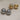 A close-up of two pairs of high-gloss dome stud earrings in gold and silver finishes, showing the smooth half-sphere front and the hollow-back construction with stud posts, resting on a textured cream fabric-2