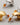 Close-up of premium chunky C-shape stud earrings featuring a rich brushed matte gold texture and 925 sterling silver posts, showcasing high-quality wire-drawn surface details-2