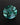 Evergleam Jewelry 11mm round teal lab-grown sapphire with a hand-cut geometric star pattern on a black background.